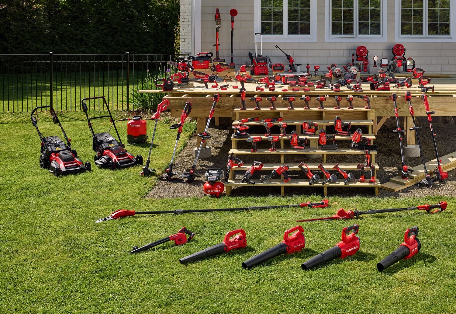 Photo of Craftsman outdoor power tools, mowers, blowers, and trimmers arranged outdoors. SKU visible: not provided.