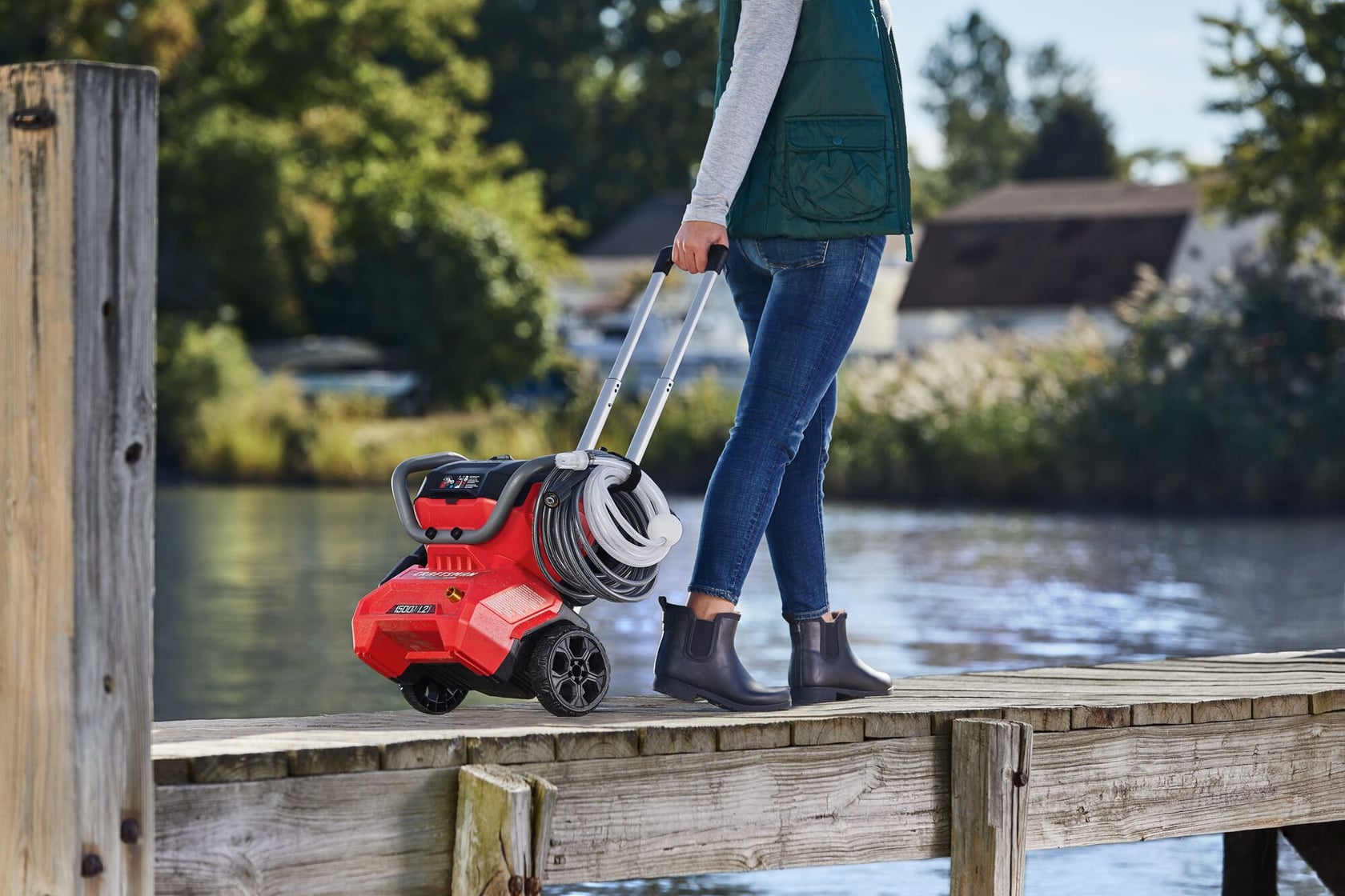 CRAFTSMAN 1500 PSI Pressure Washer being wheeled on pier by female