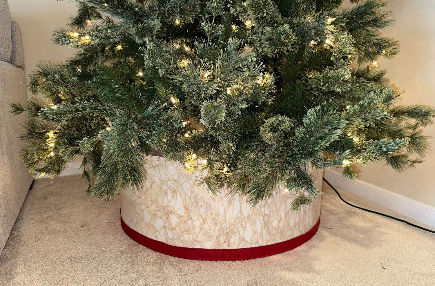 Custom marble tree skirt with a green christmas tree above