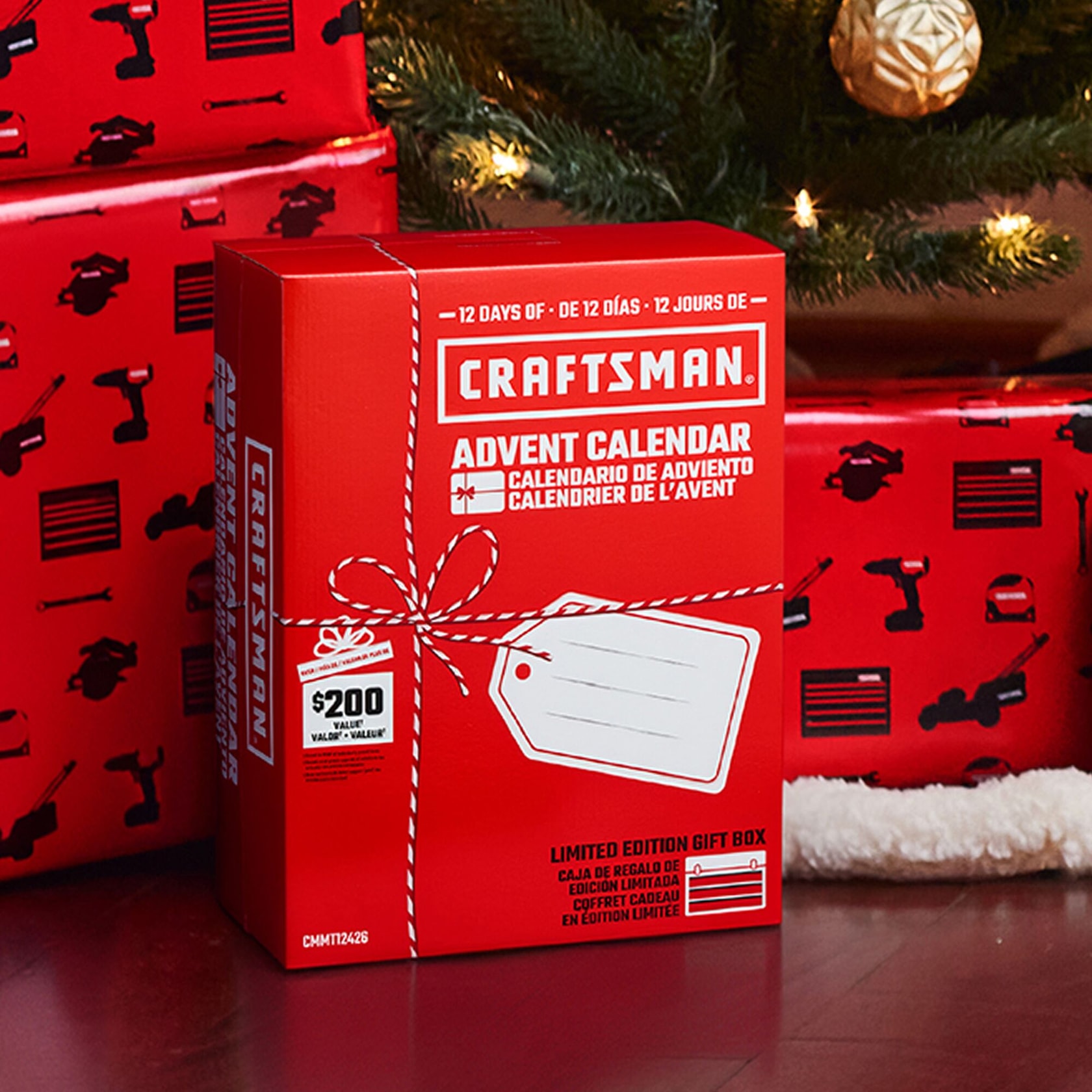 CRAFTSMAN Advent Calendar gift box in red, placed near wrapped presents under a Christmas tree.