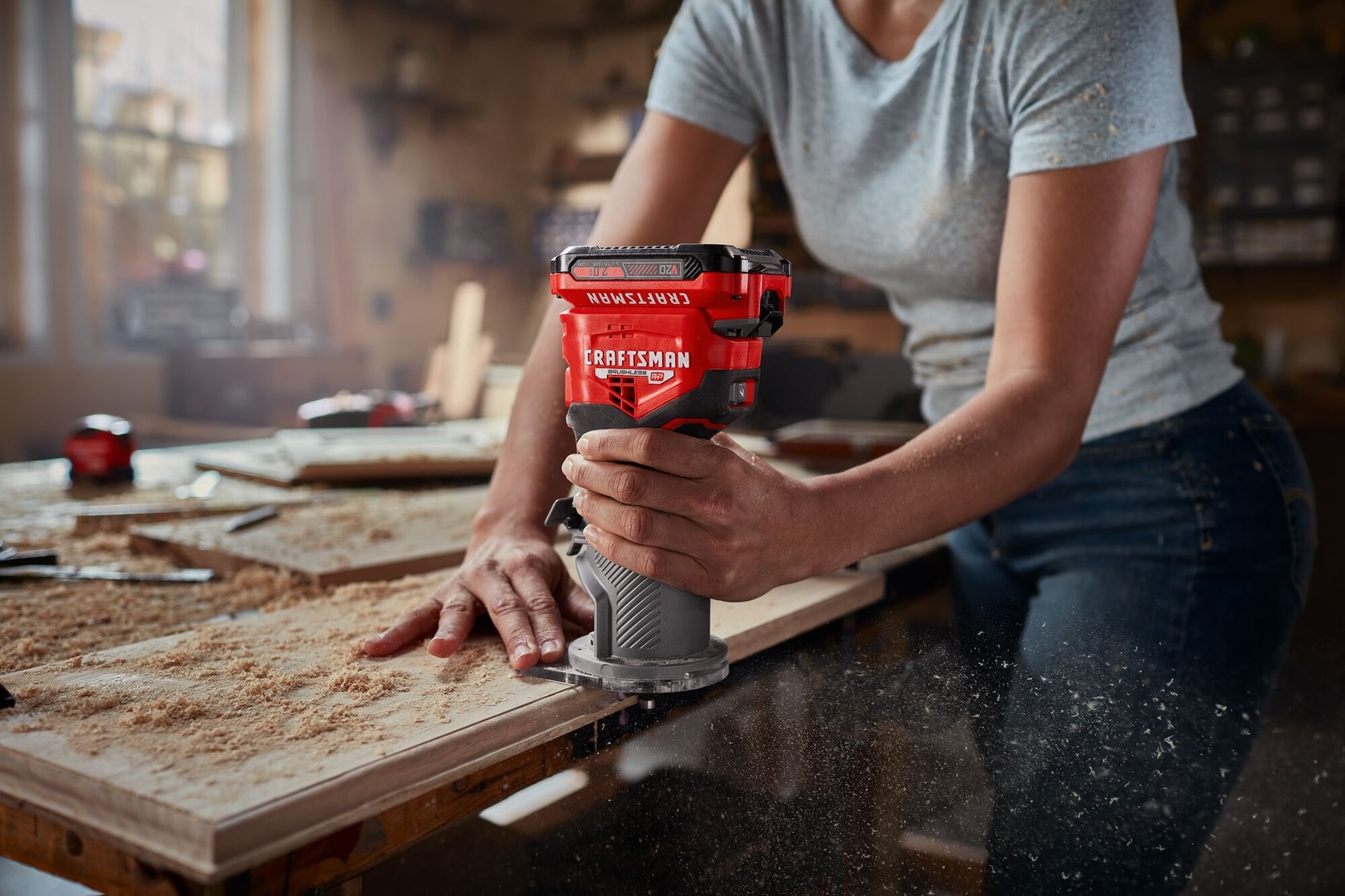 Woman in white tee shirt using V20 Fixed Base Router