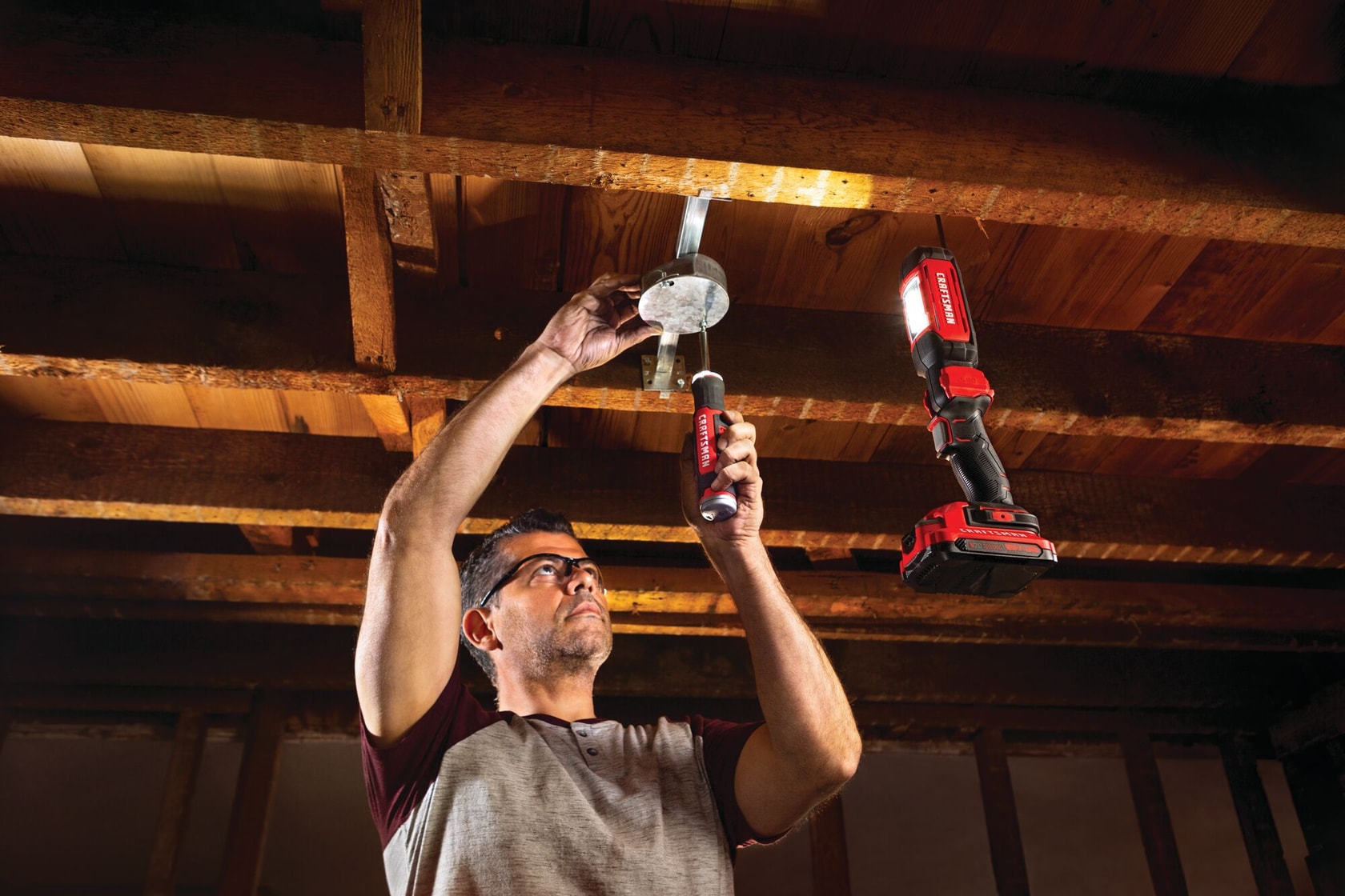 Cordless led hanging work light tool only being used for fixing things.