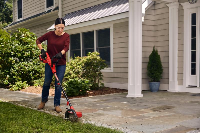 Cordless edger tool only being used for edging lawn by person.