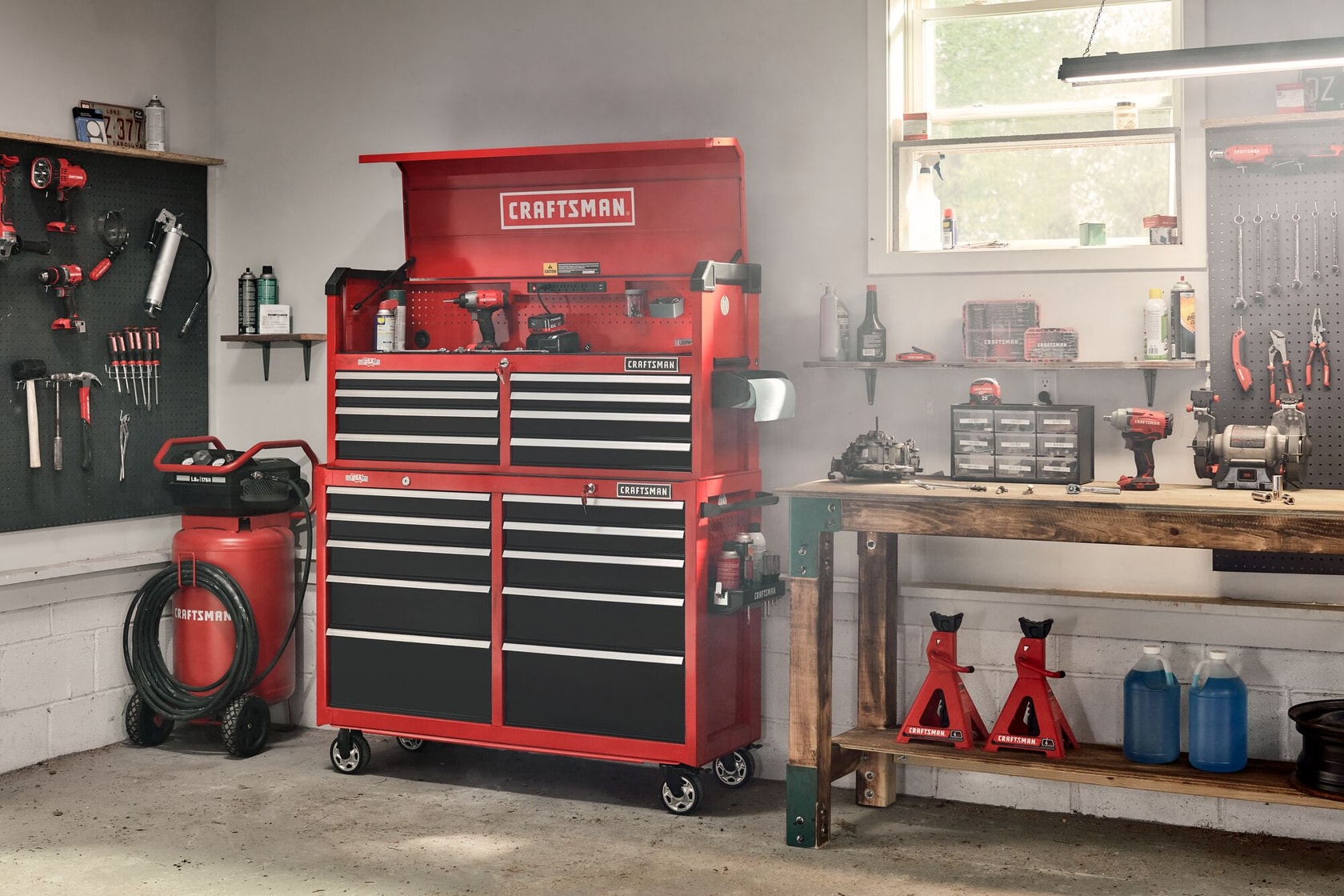 52 inch 10 drawer rolling tool cabinet with 10 drawer tool chest on top placed in workshop.