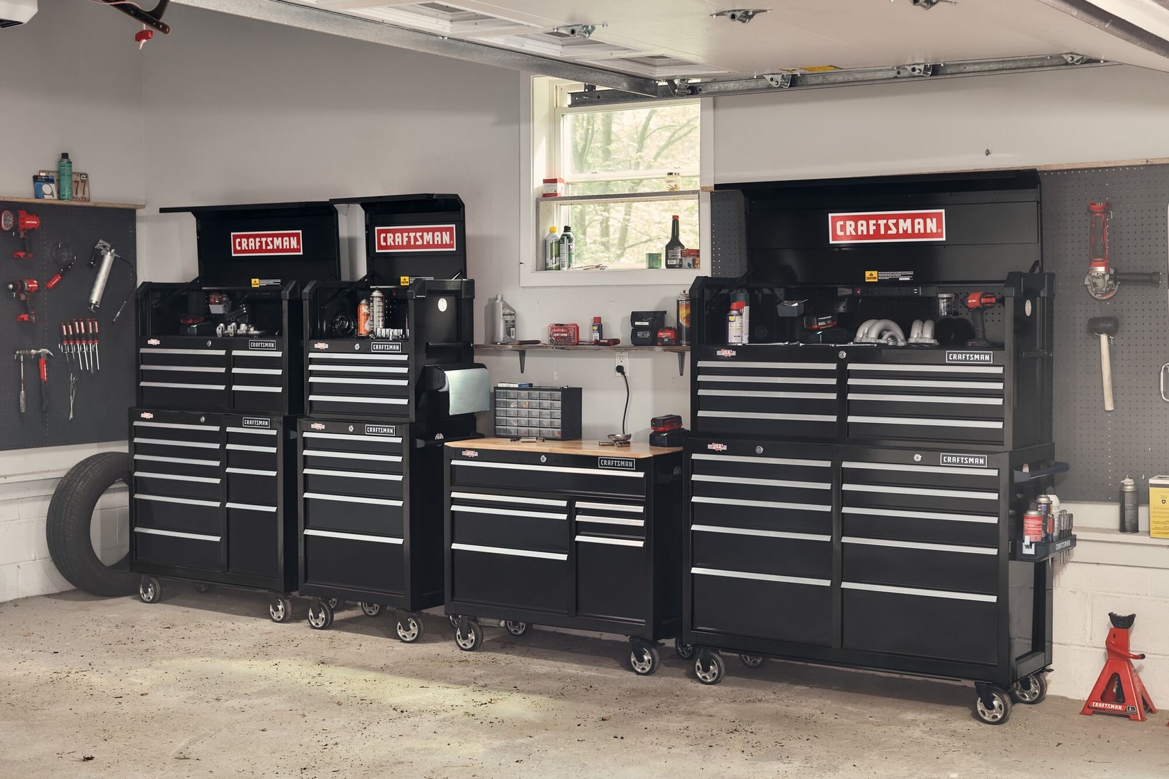 41 inch 6 drawer tool chest placed with other tool chests and rolling tool cabinet in workshop.