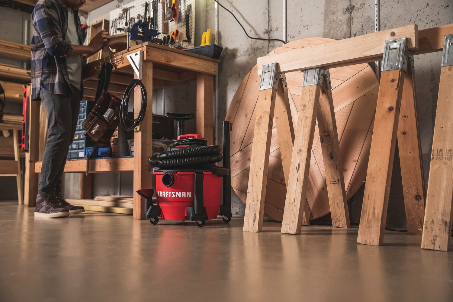 6 gallon 3.5 Peak h p wet and dry vac with attachments placed in the garage.